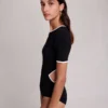 Bodysuit i öppen stickning Bodysuit i öppen stickning
