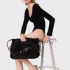 Bodysuit i sammet med korsettdetaljer Bodysuit i sammet med korsettdetaljer