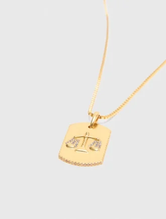 Halsband med stjärnteckensplakett