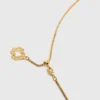 Halsband med stjärnteckensplakett
