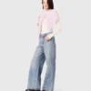 Jeans med vida ben och strass över hela plagget Jeans med vida ben och strass över hela plagget