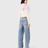 Jeans med vida ben och strass över hela plagget Jeans med vida ben och strass över hela plagget