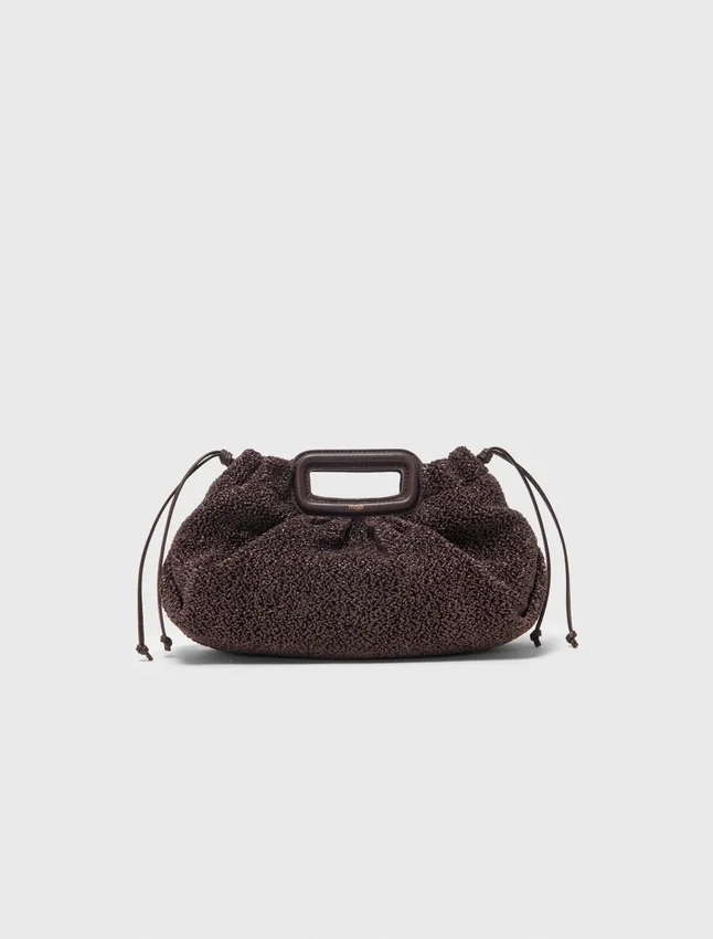 Mipli-clutch med bouclé-effekt Mipli-clutch med bouclé-effekt