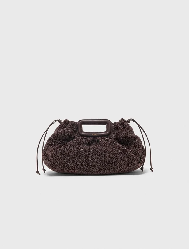 Mipli-clutch med bouclé-effekt Mipli-clutch med bouclé-effekt