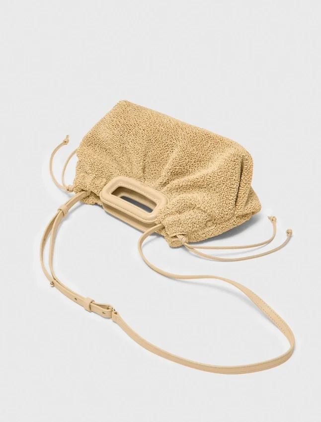 Mipli-clutch med bouclé-effekt Mipli-clutch med bouclé-effekt