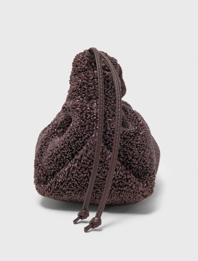 Mipli-clutch med bouclé-effekt Mipli-clutch med bouclé-effekt