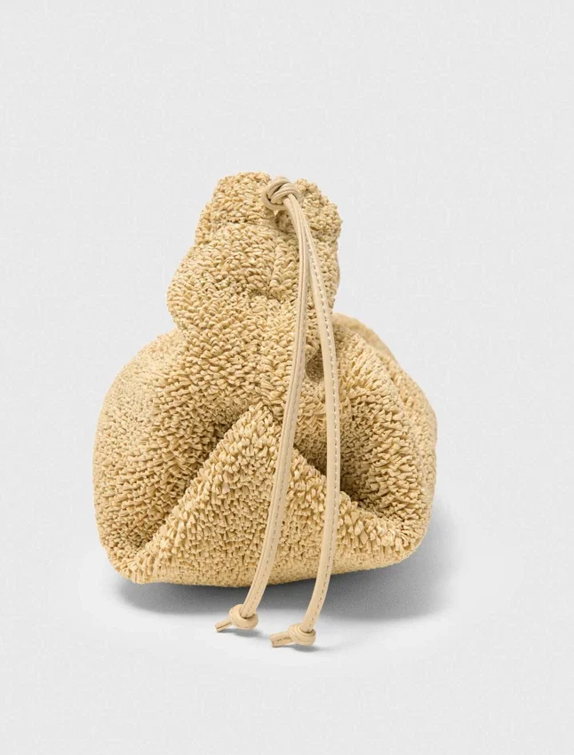 Mipli-clutch med bouclé-effekt Mipli-clutch med bouclé-effekt